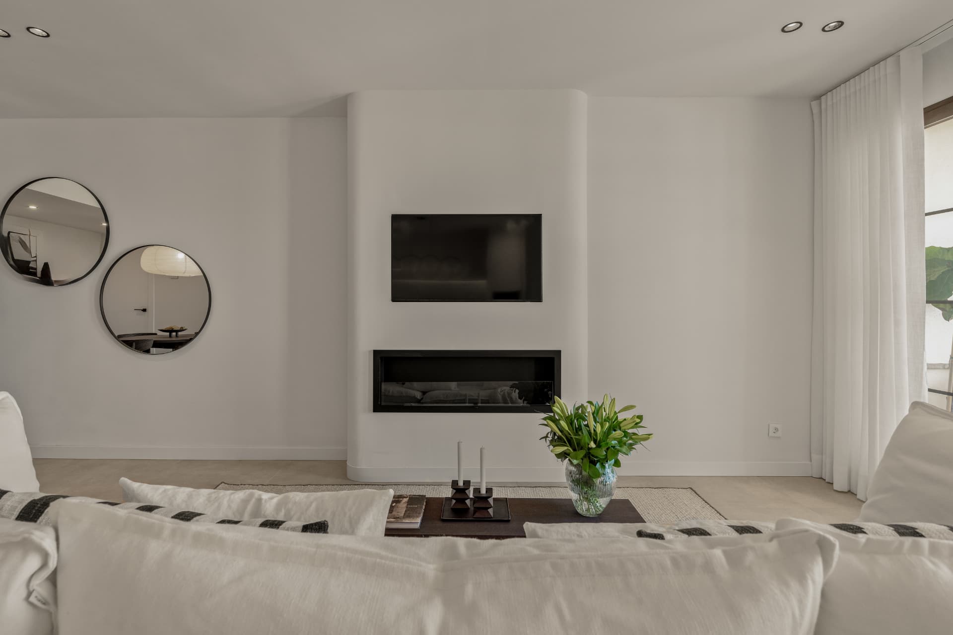 Living room with television and fireplace