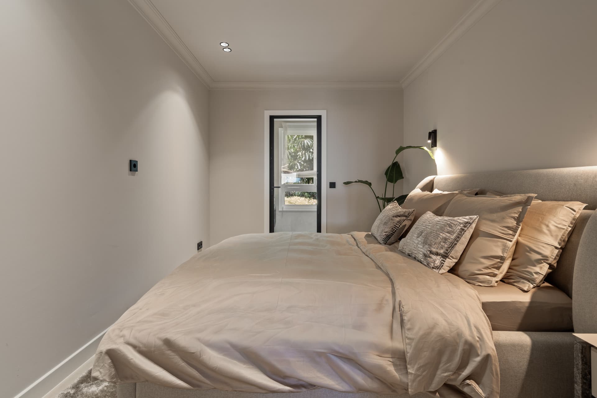 Third bedroom with door to a small patio