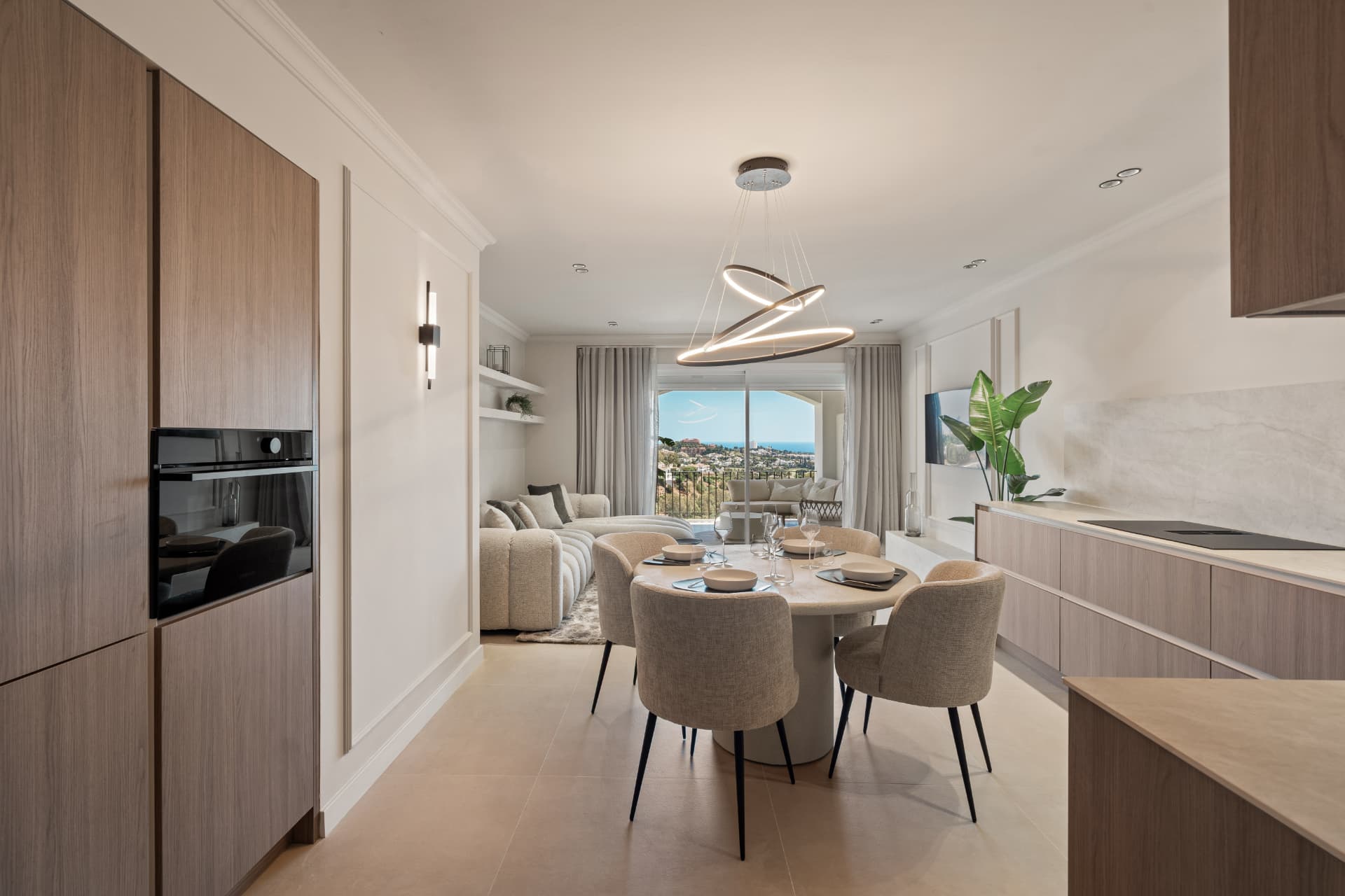 Open kitchen with dining table and lounge beyond